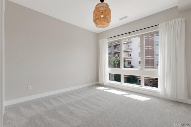 spare room with light colored carpet