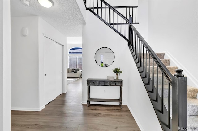 275 S Pembrook St, Castle Rock, CO 80104 - stairway with wood finished floors and baseboards