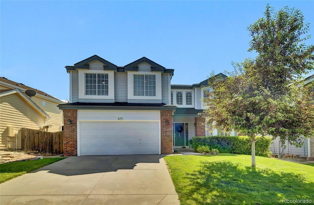 275 S Pembrook St, Castle Rock, CO 80104 - view of front facade featuring brick siding, driveway, and an attached garage