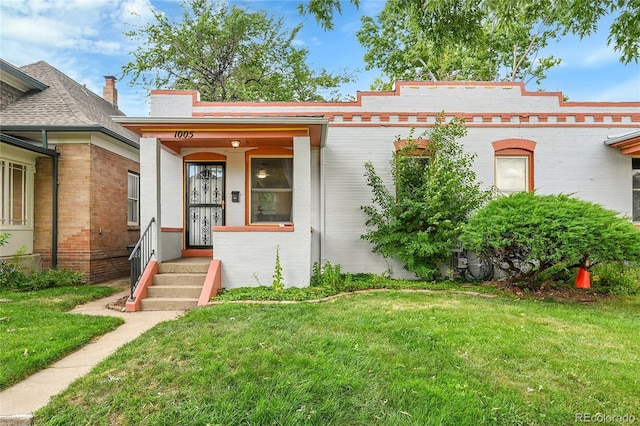 1005 S Pennsylvania St, Denver, CO 80209 - view of front of property with a front lawn and brick siding