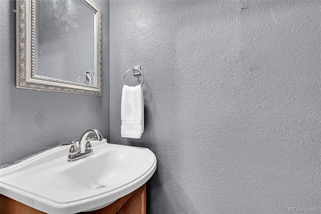 1005 S Pennsylvania St, Denver, CO 80209 - bathroom featuring vanity and a textured wall
