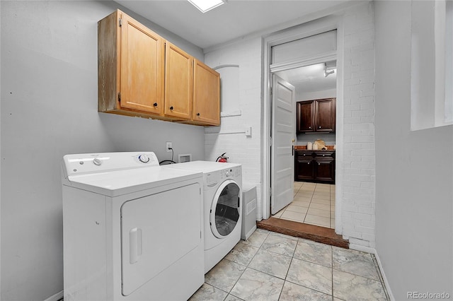 1005 S Pennsylvania St, Denver, CO 80209 - laundry area with cabinet space and washing machine and clothes dryer