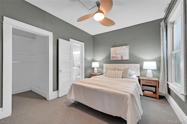 1005 S Pennsylvania St, Denver, CO 80209 - carpeted bedroom with ensuite bath and a ceiling fan