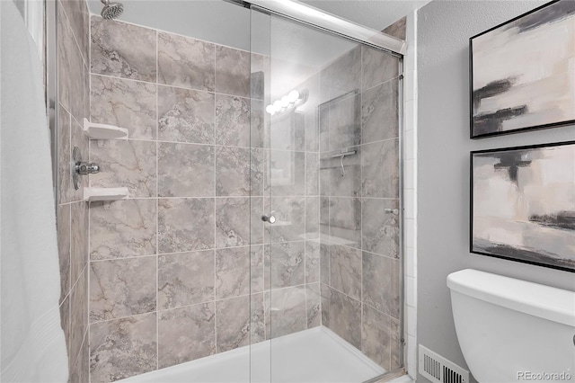 1005 S Pennsylvania St, Denver, CO 80209 - bathroom featuring a stall shower and toilet