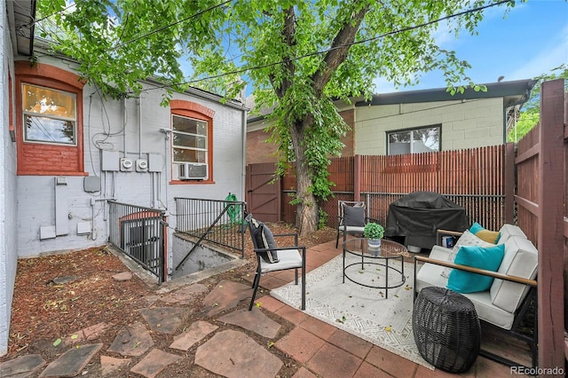 1005 S Pennsylvania St, Denver, CO 80209 - view of patio with area for grilling, cooling unit, and a gate