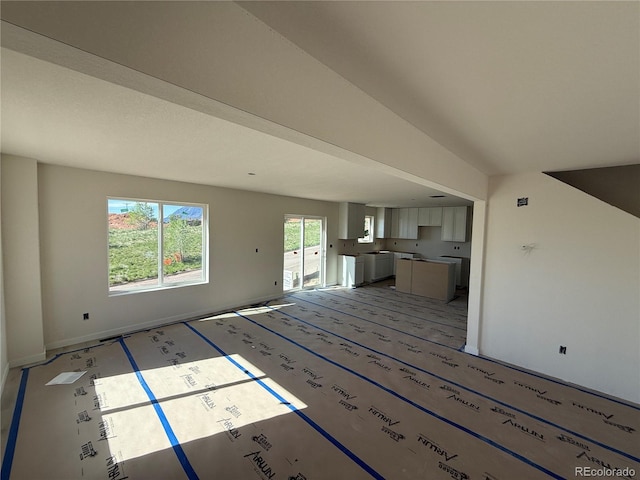 701 Little Bear, Colorado Springs, CO 80907 - unfurnished living room with baseboards