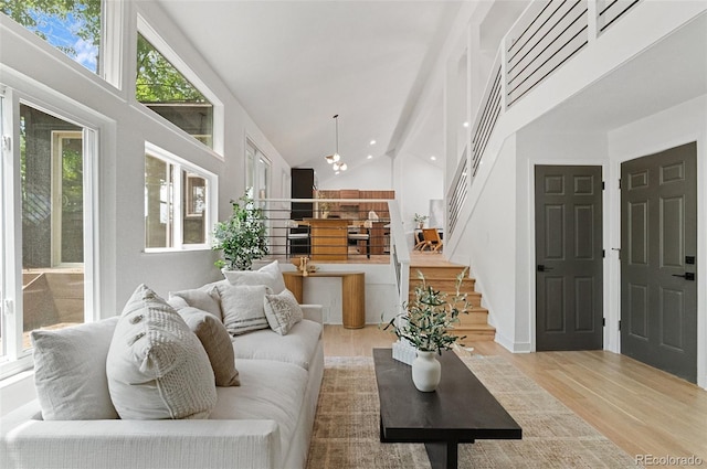 4269 Carter Trl, Boulder, CO 80301 - living room with high vaulted ceiling, stairs, and wood finished floors