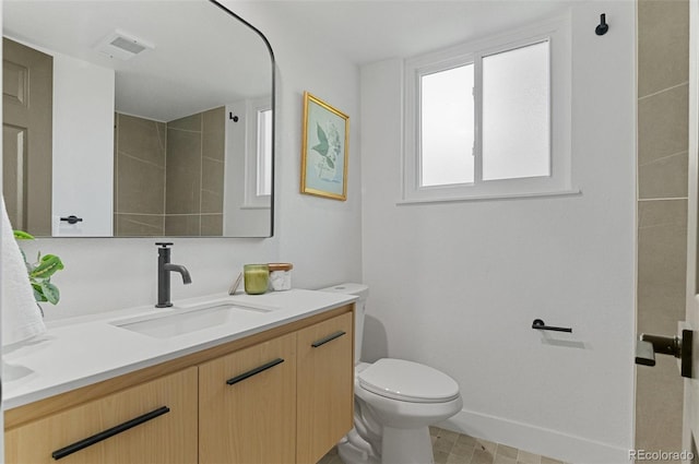 4269 Carter Trl, Boulder, CO 80301 - bathroom featuring vanity, toilet, and baseboards