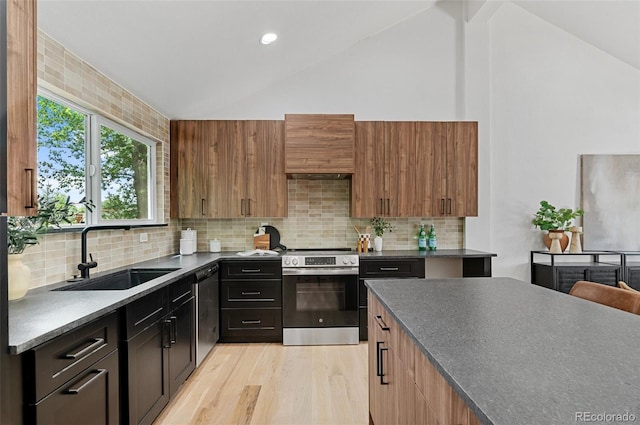 4269 Carter Trl, Boulder, CO 80301 - kitchen with appliances with stainless steel finishes, a sink, dark countertops, premium range hood, and light wood-style floors