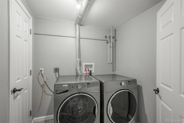 washroom with washer and clothes dryer and laundry area