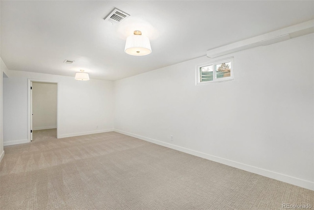 basement featuring light carpet