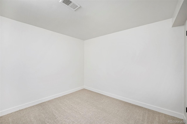 unfurnished room with light carpet