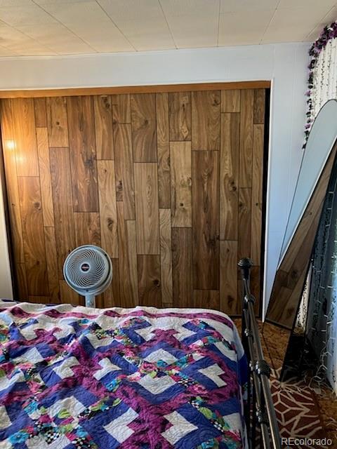 440 Colorado Ave, Stratton, CO 80836 - bedroom with wooden walls