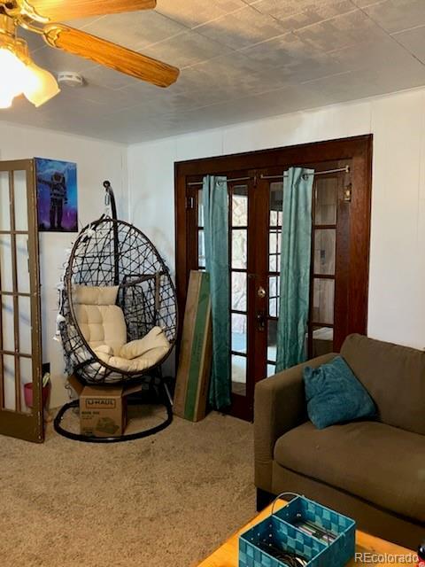 440 Colorado Ave, Stratton, CO 80836 - living area with french doors, carpet flooring, and ceiling fan
