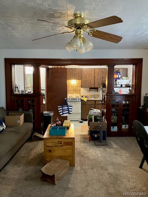 440 Colorado Ave, Stratton, CO 80836 - living area featuring carpet floors and ceiling fan
