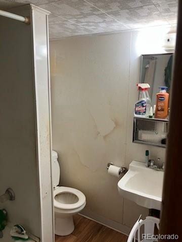 440 Colorado Ave, Stratton, CO 80836 - bathroom with an enclosed shower and wood finished floors
