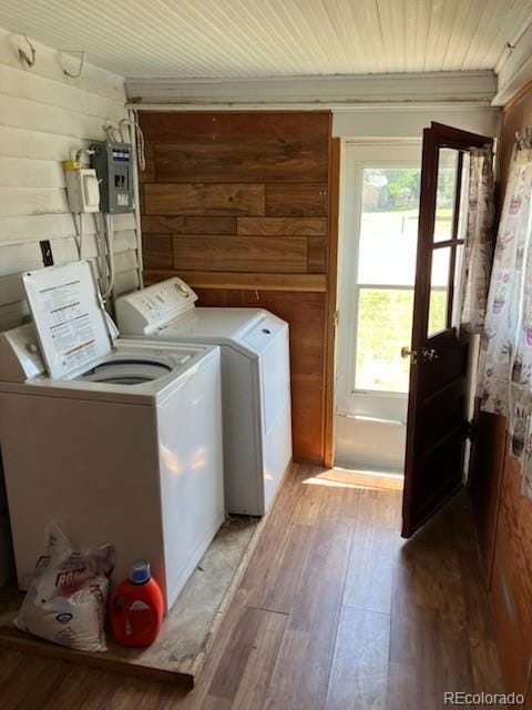 440 Colorado Ave, Stratton, CO 80836 - laundry area featuring washer and dryer, wood finished floors, wooden ceiling, and electric panel