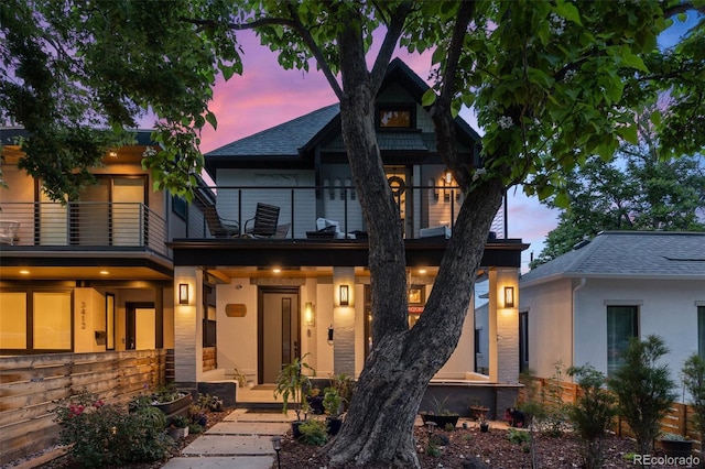 3410 Pecos St, Denver, CO 80211 - view of front of house featuring a balcony, stucco siding, and roof with shingles