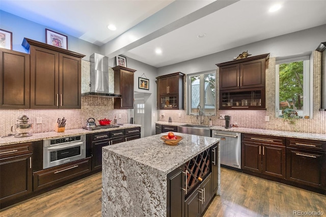 3410 Pecos St, Denver, CO 80211 - kitchen featuring stainless steel appliances, wall chimney exhaust hood, dark wood-style floors, backsplash, and recessed lighting