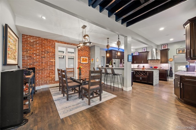 3410 Pecos St, Denver, CO 80211 - dining room featuring brick wall and dark wood-type flooring