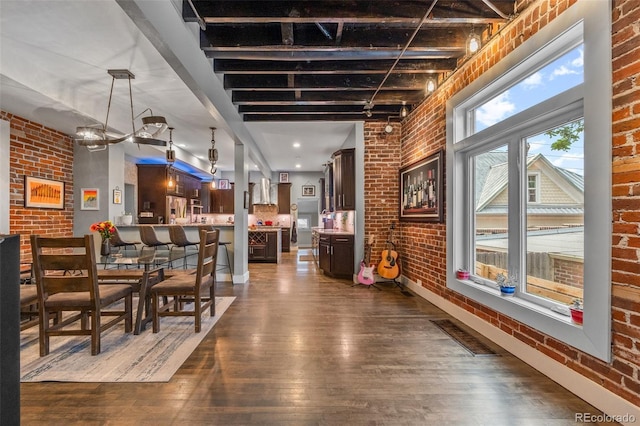 3410 Pecos St, Denver, CO 80211 - dining room featuring brick wall and dark wood finished floors