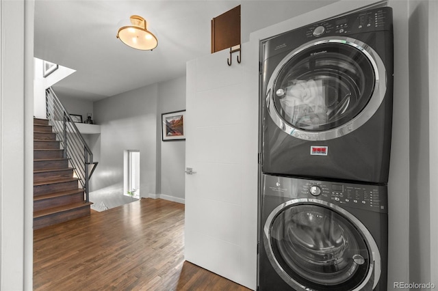 3410 Pecos St, Denver, CO 80211 - laundry area featuring stacked washer / dryer and wood finished floors