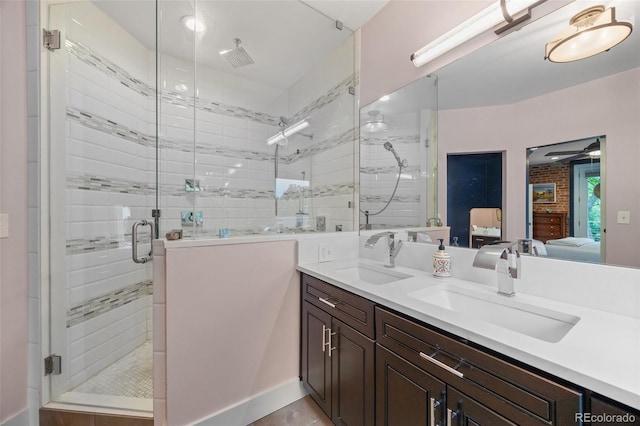 3410 Pecos St, Denver, CO 80211 - bathroom with ensuite bathroom, a stall shower, double vanity, and a ceiling fan
