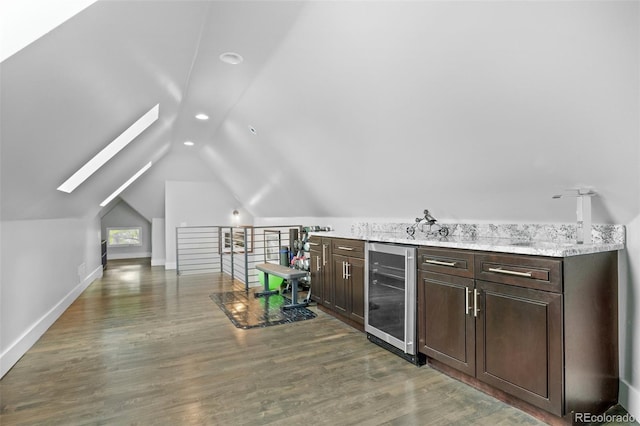 3410 Pecos St, Denver, CO 80211 - additional living space featuring beverage cooler, lofted ceiling, recessed lighting, wood finished floors, and a bar