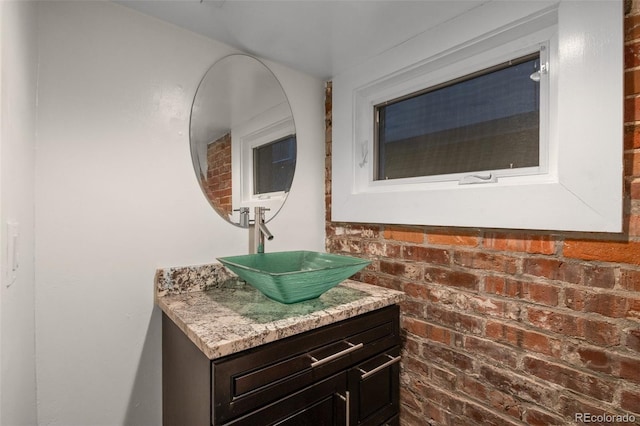 3410 Pecos St, Denver, CO 80211 - bathroom with vanity and brick wall