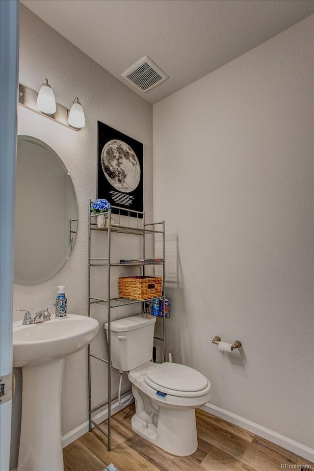4505 Cholla Trl, Castle Rock, CO 80104 - half bath with wood finished floors and toilet