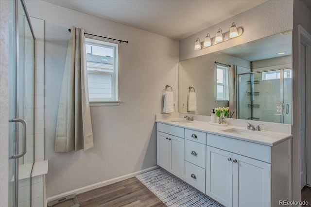 4505 Cholla Trl, Castle Rock, CO 80104 - bathroom with wood finished floors, double vanity, and a shower stall