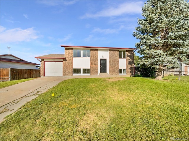 12238 Monroe Dr, Thornton, CO 80241 - view of front of property featuring driveway, brick siding, and an attached garage