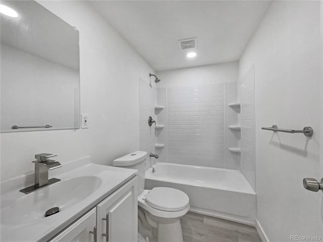 12238 Monroe Dr, Thornton, CO 80241 - bathroom featuring vanity, wood finished floors, bathtub / shower combination, and recessed lighting