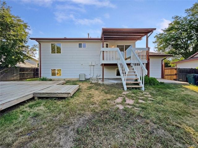 12238 Monroe Dr, Thornton, CO 80241 - rear view of house featuring a fenced backyard, a deck, and stairs