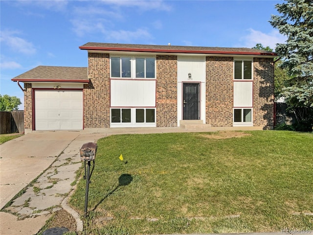 12238 Monroe Dr, Thornton, CO 80241 - rear view of house with brick siding, driveway, and a garage