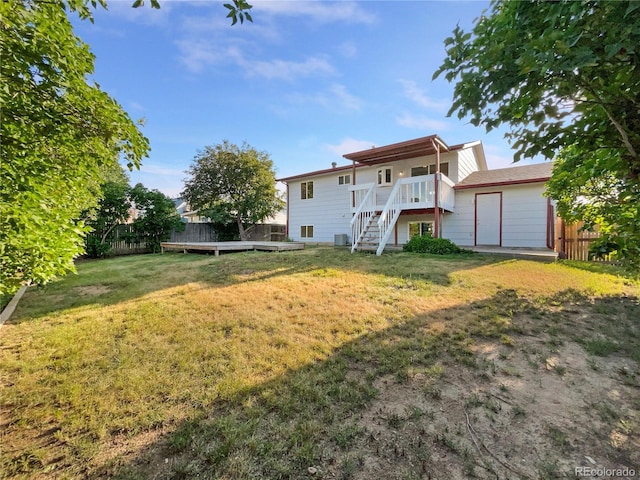 12238 Monroe Dr, Thornton, CO 80241 - back of property with stairway and a deck