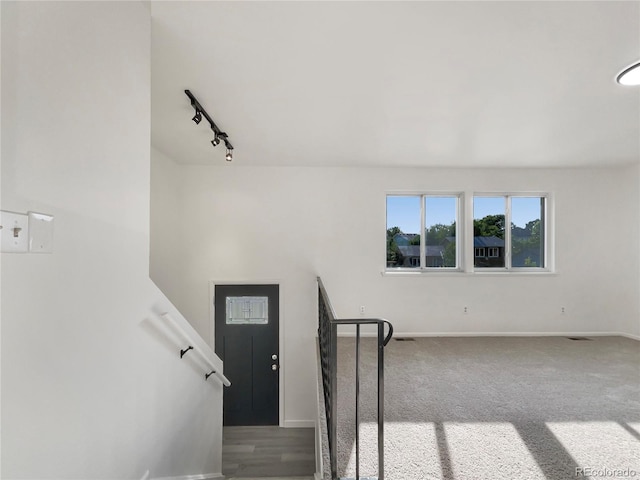 12238 Monroe Dr, Thornton, CO 80241 - staircase with track lighting and baseboards