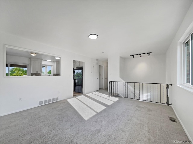 12238 Monroe Dr, Thornton, CO 80241 - spare room featuring carpet flooring and track lighting