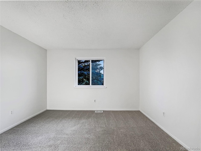 12238 Monroe Dr, Thornton, CO 80241 - carpeted spare room featuring a textured ceiling and baseboards