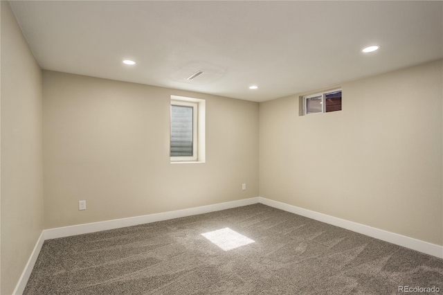 finished basement featuring recessed lighting, baseboards, and carpet