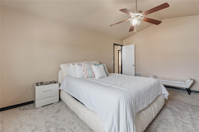 bedroom featuring lofted ceiling, light colored carpet, and ceiling fan