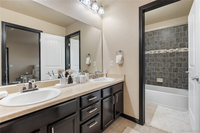 bathroom with vanity and tile patterned flooring