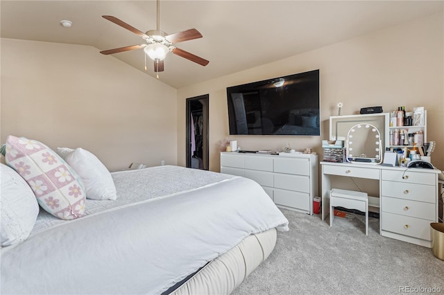 bedroom with vaulted ceiling, light colored carpet, and ceiling fan