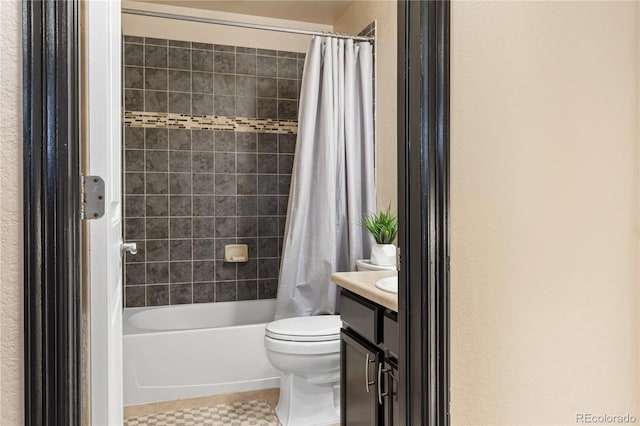 full bathroom featuring shower / bath combo, vanity, tile patterned floors, and toilet