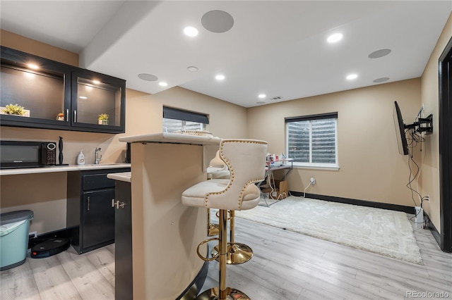 interior space with sink and light hardwood / wood-style floors