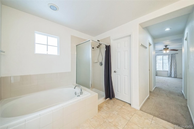 bathroom with tile patterned flooring, ceiling fan, and shower with separate bathtub