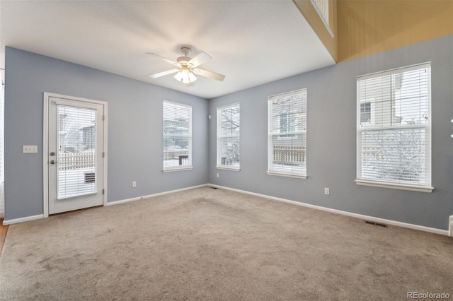 carpeted empty room with ceiling fan