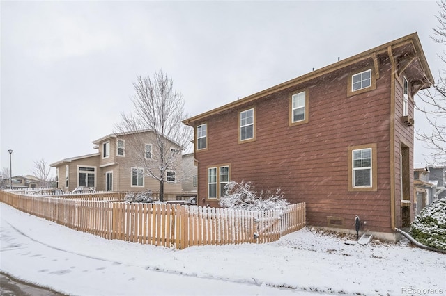 view of snow covered house