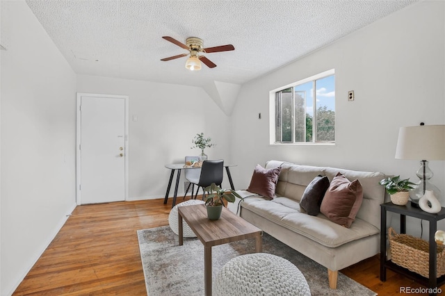 274 S Lincoln St, Denver, CO 80209 - living area with ceiling fan, light wood-style floors, and a textured ceiling