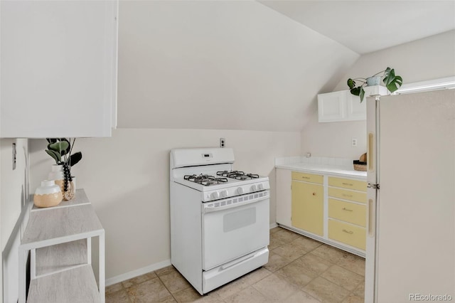 274 S Lincoln St, Denver, CO 80209 - kitchen featuring white appliances, vaulted ceiling, and light countertops
